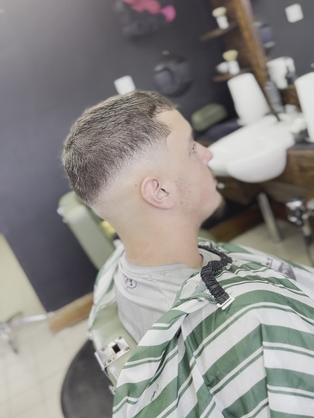 High skin fade blending into a short textured crop
